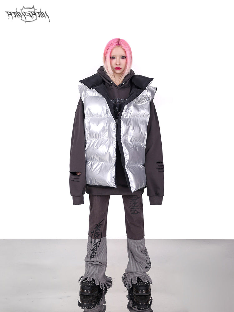 PINKSPINK ORBIT reversible padded vest in black silver — silver-side front full-length modeled view layered over a gray hoodie