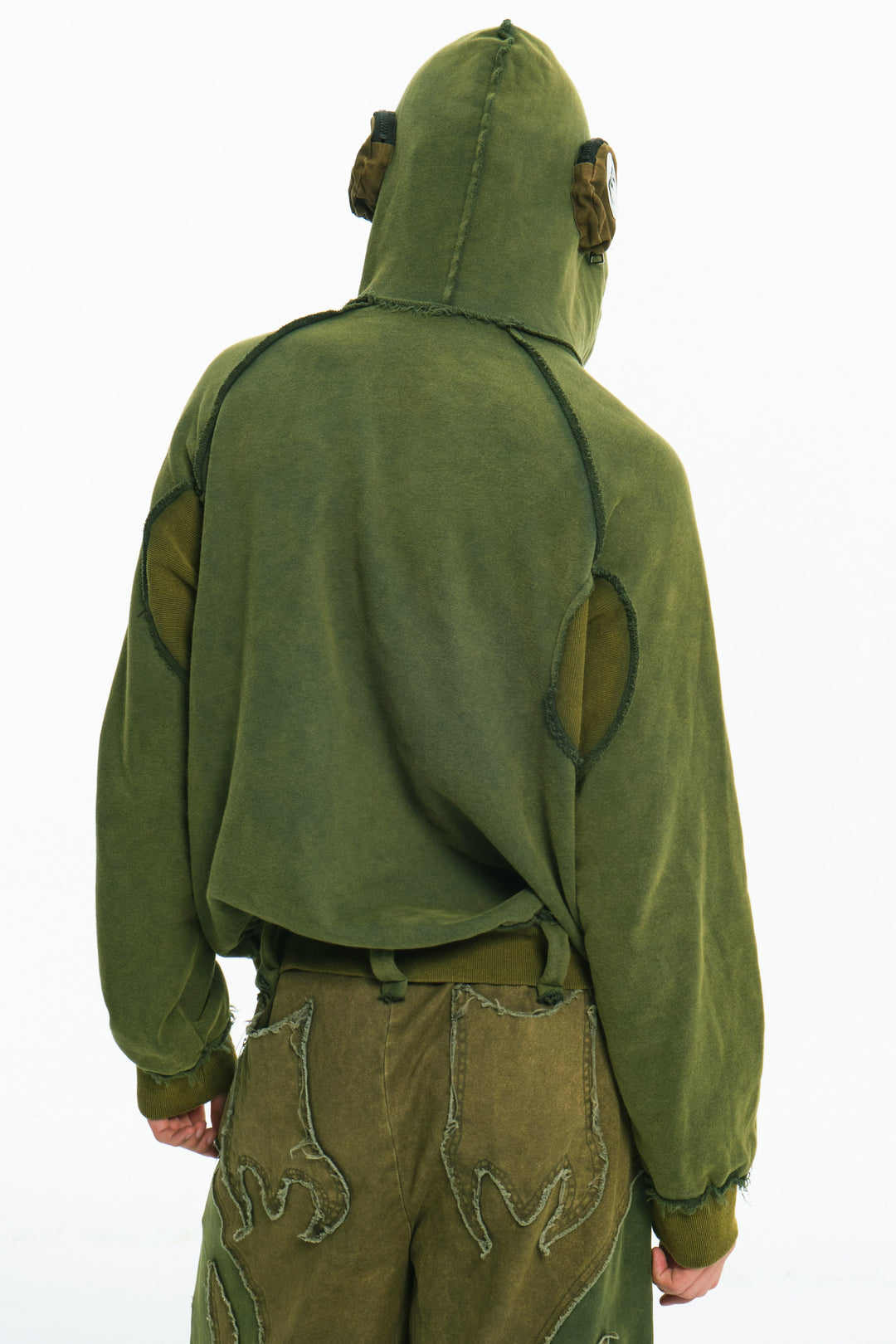 EMBRYO GREEN GUARD distressed armor hoodie — close modeled view