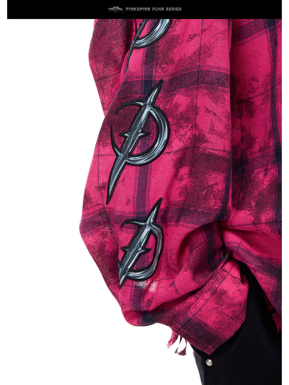 PINKSPINK ELECTRIC MOON distressed oversized plaid shirt in pink and black plaid — close sleeve detail showing raised crescent appliqués