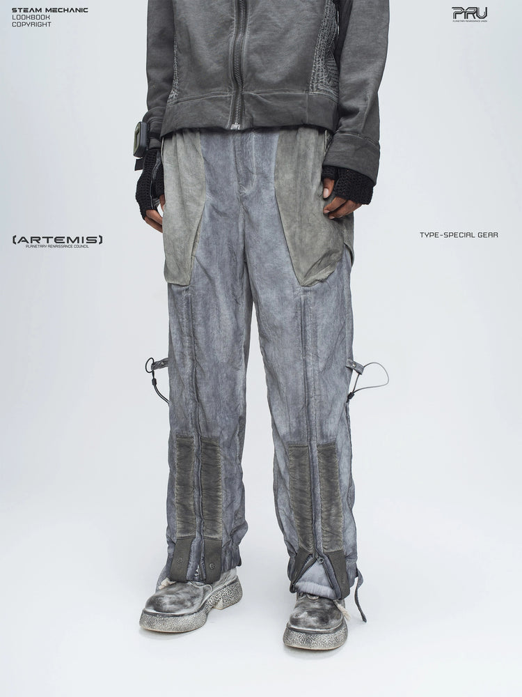 STARCORE moon dust gray engineer utility pants — opposite three-quarter front modeled view