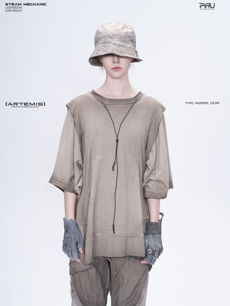 PIONEER mercury brown distressed nylon bucket hat — front modeled view with the brim lowered over the eyes