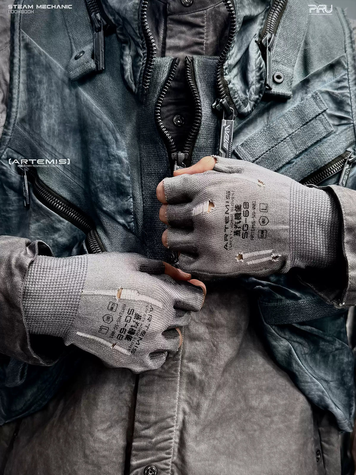 STEAM FUNCTION PRECISION CASTING distressed fingerless gloves in moon-dust gray — modeled waist-level close-up showing both printed glove backs and open fingertips