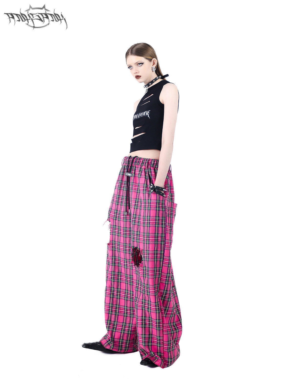 PINKSPINK PINK RIOT distressed plaid wide-leg pants — pink plaid side view showing the wide silhouette