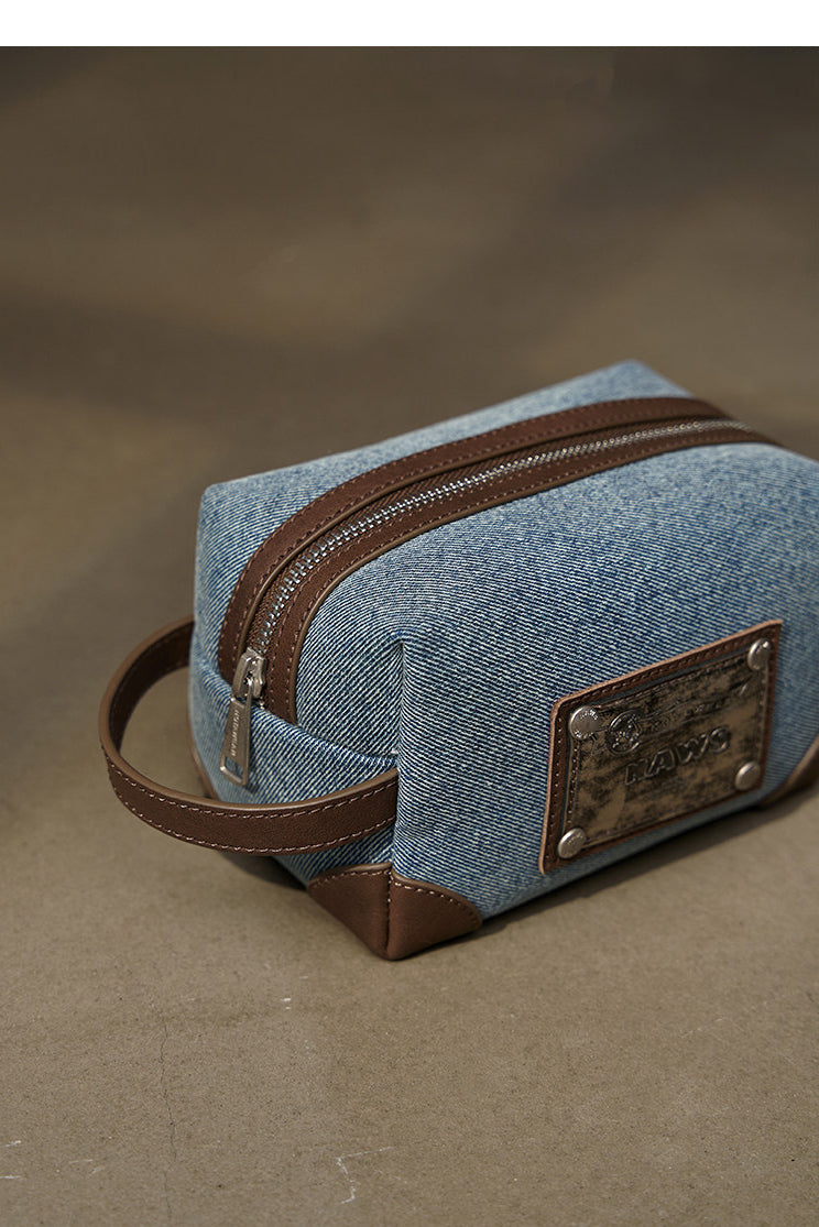 NAWS BLUE BOX denim makeup bag — product detail view showing texture and hardware