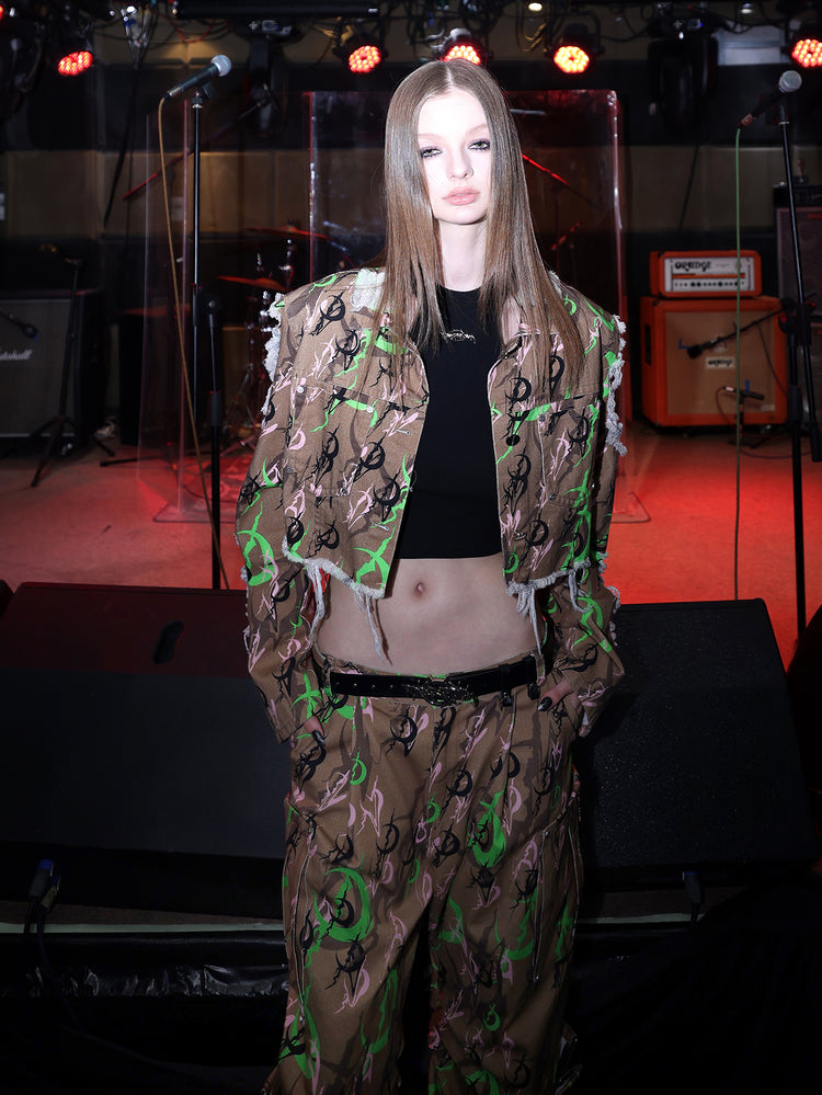 PINKSPINK ELECTRIC MOON distressed camo cropped jacket in CAMOUFLAGE — close front view showing the raw sleeve edges.