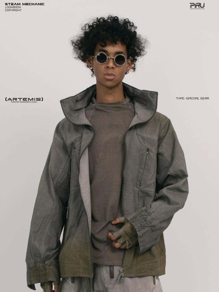 ARTEMIS tuck-paneled technical jacket in lunar soil green — close modeled front view showing the raised collar and four pockets