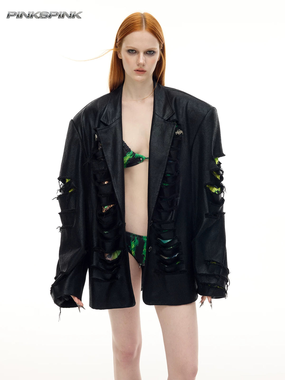 PINKSPINK BREACH distressed coated oversized blazer in black — front modeled view worn open, showing the lapels and slashed sleeves
