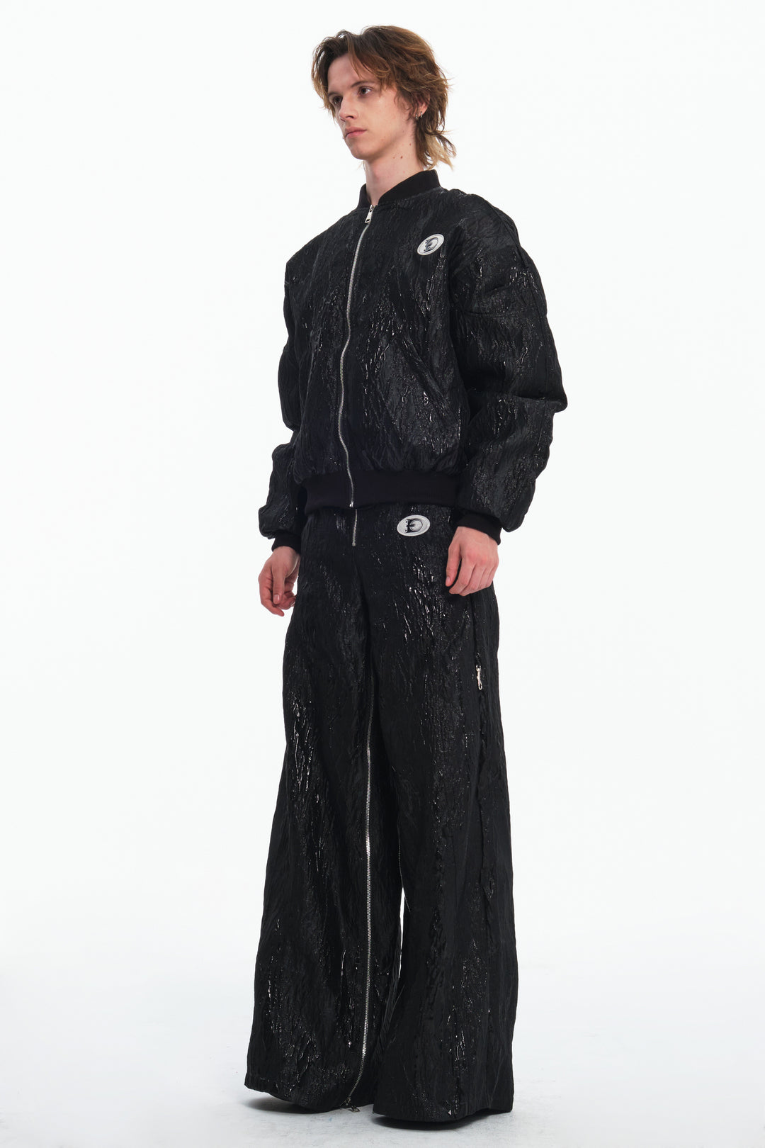 EMBRYO VENOM FLIGHT deconstructed padded jacket — full-length modeled styling view