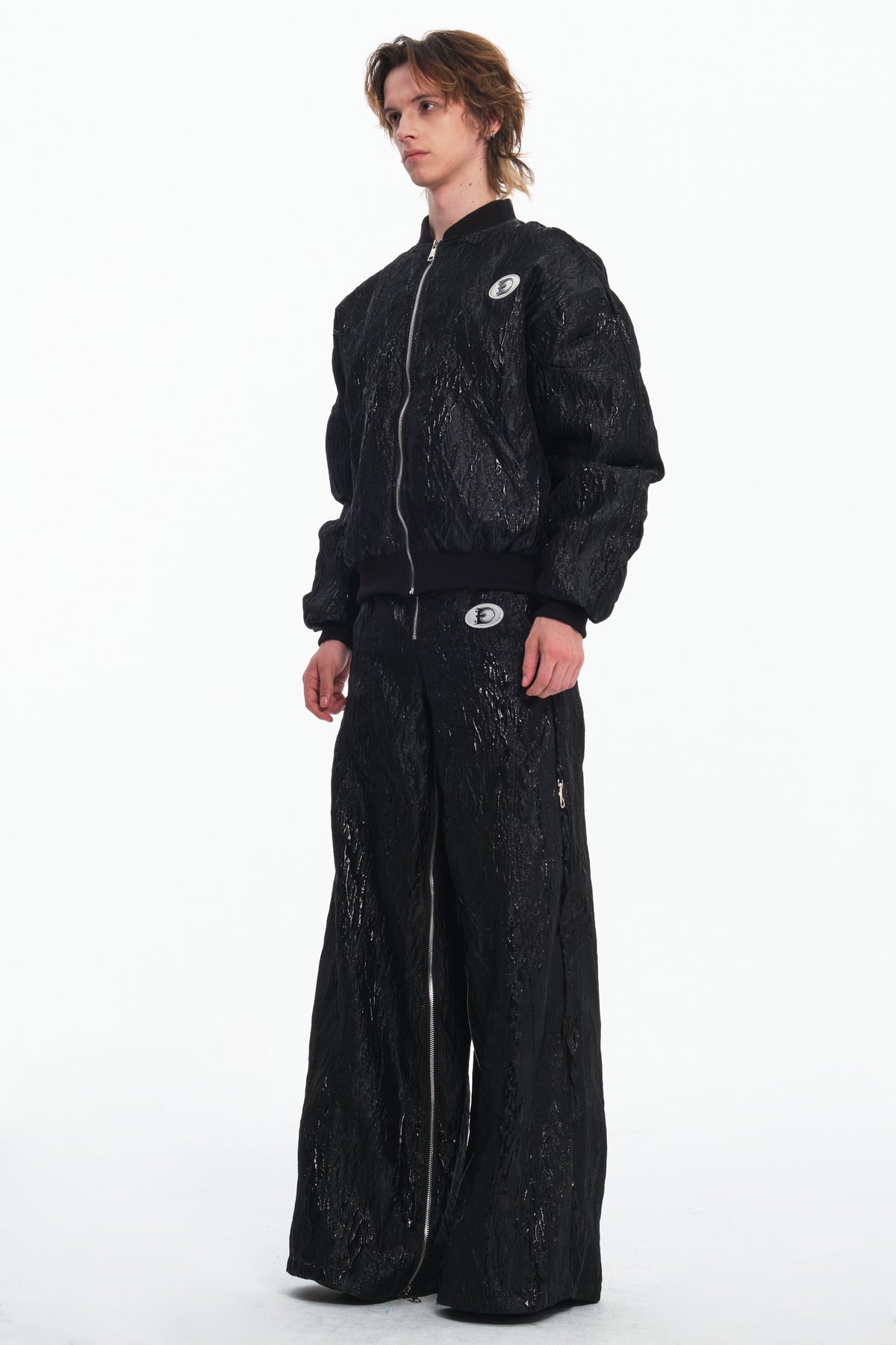 EMBRYO VENOM FLIGHT deconstructed padded jacket — full-length modeled styling view