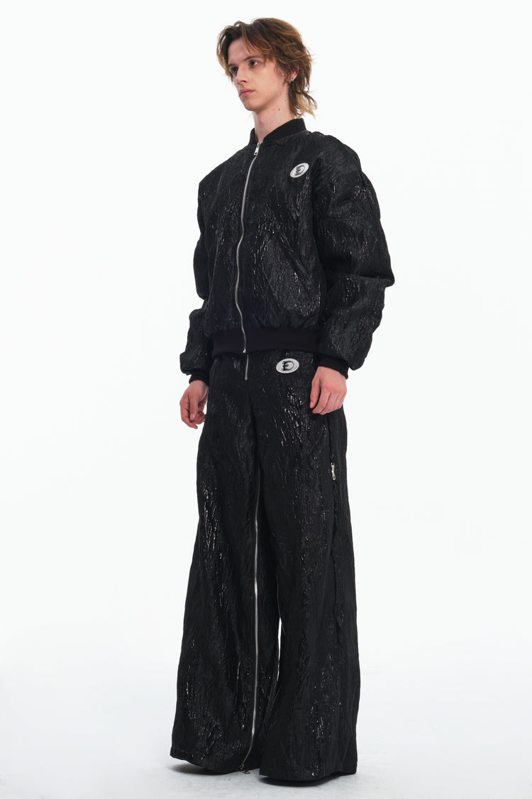 EMBRYO VENOM FLIGHT deconstructed padded jacket — full-length modeled styling view