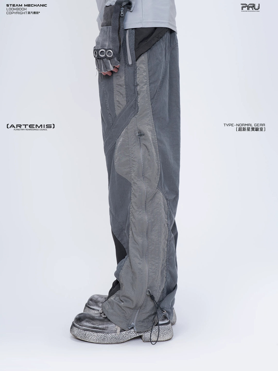 SUPERNOVA alloy gray metallic nylon technical pants — rear modeled view