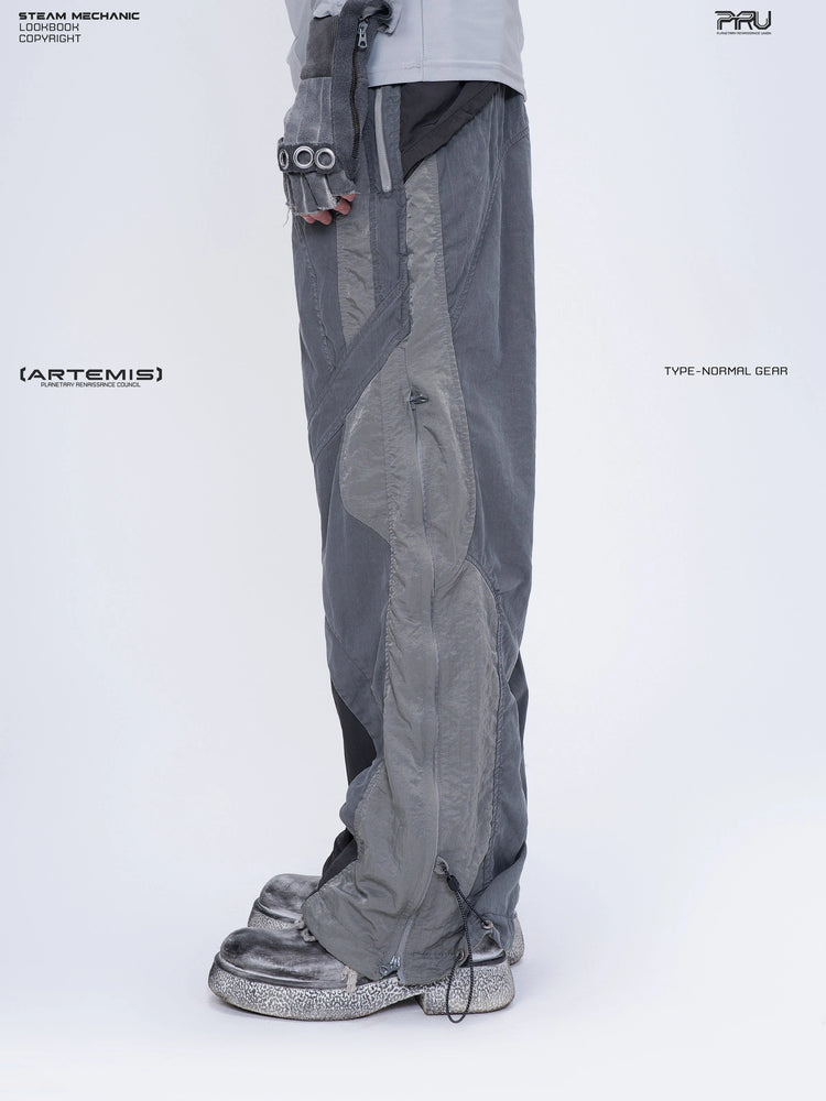 SUPERNOVA alloy gray metallic nylon technical pants — side modeled close-up showing the zip pocket