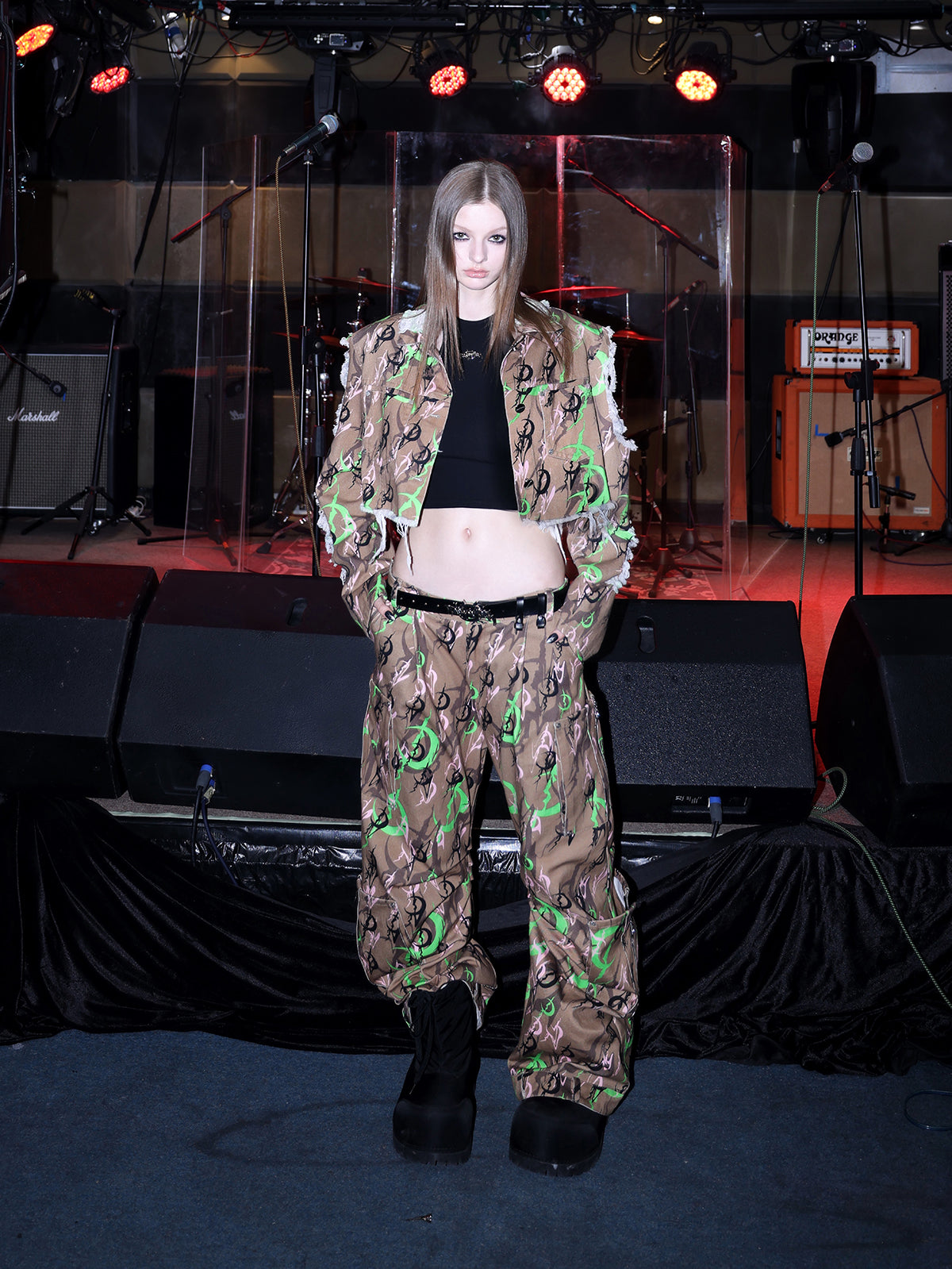 PINKSPINK ELECTRIC MOON distressed camo cropped jacket in CAMOUFLAGE — full-body front view styled with a black top.