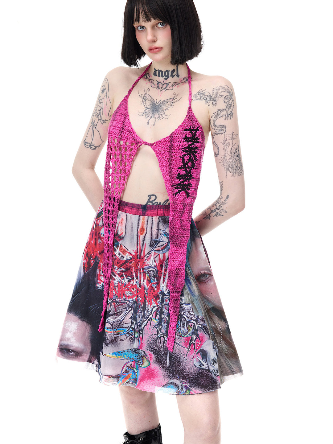 PINKSPINK THORNSTAR open-knit halter top in hot pink — three-quarter front modeled view with the star-shaped panels spread over the waist