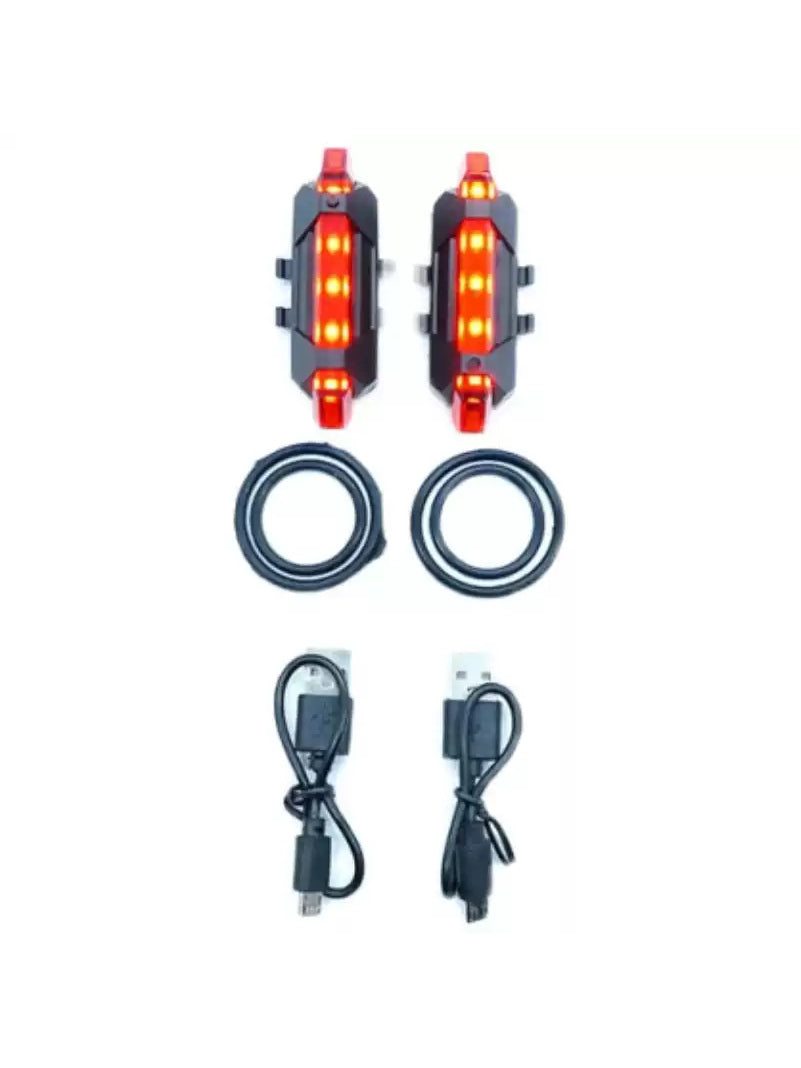 FOCKSHOP TRAIN L rechargeable costume light pair — red pair with rubber mounting rings and USB cables