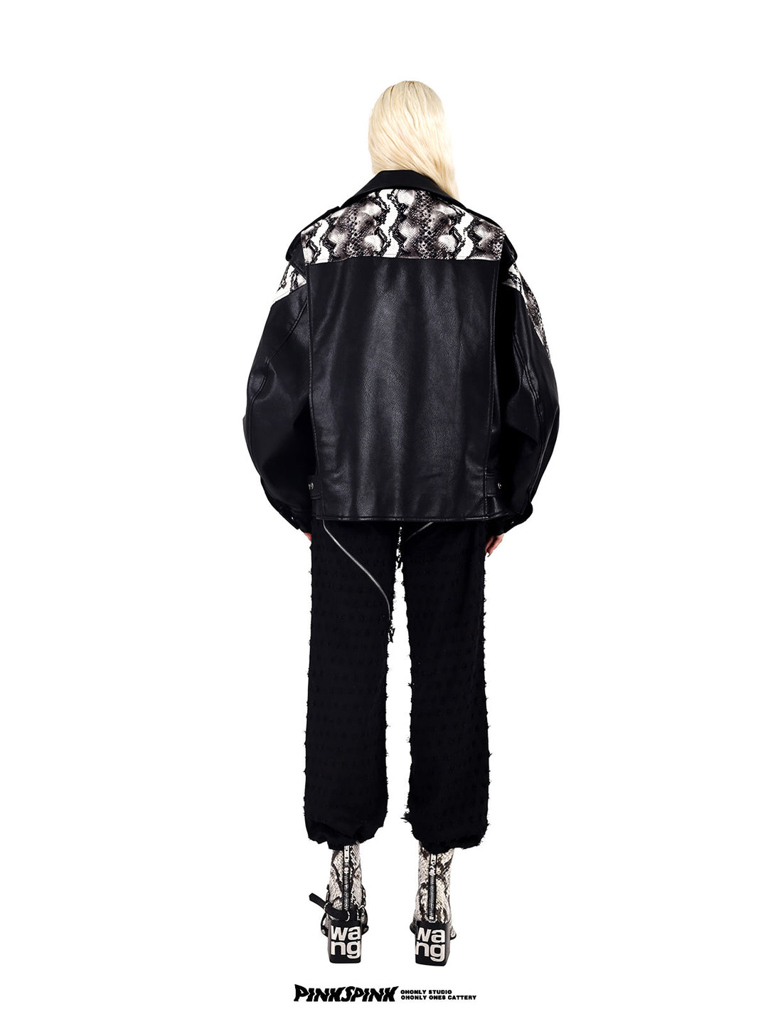 PINKSPINK COBRA snake-print faux-leather moto jacket — black back view styled with distressed trousers