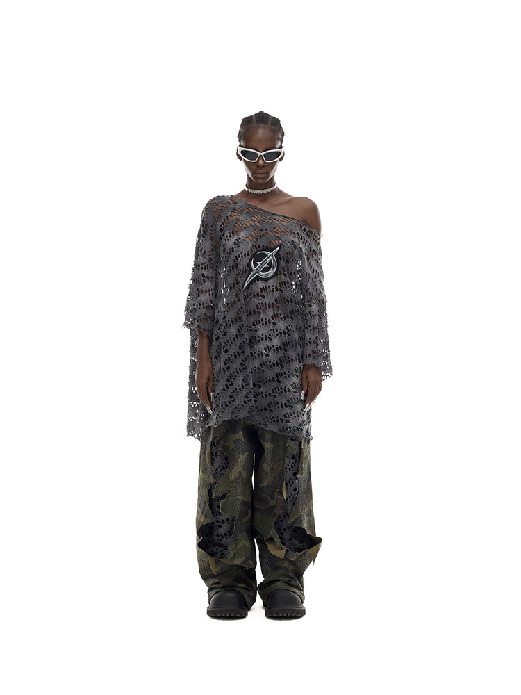 PINKSPINK ELECTRIC MOON distressed open-knit oversized tee in charcoal gray — full-length front modeled view with camouflage trousers