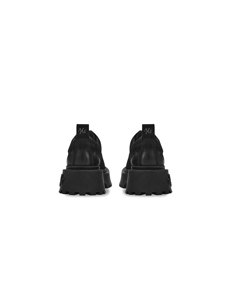 NAWS MOORE matte leather platform Derby shoes in MOORE BLACK — rear shoe-only view showing pull tabs and branded platform heels.