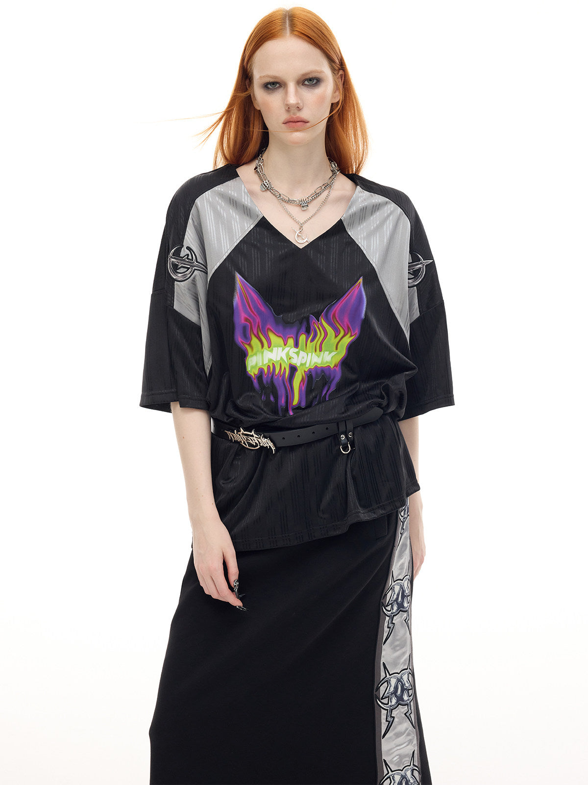 PINKSPINK FLAMECAT oversized sports jersey in black and gray — close frontal modeled view of the neon flame-cat graphic