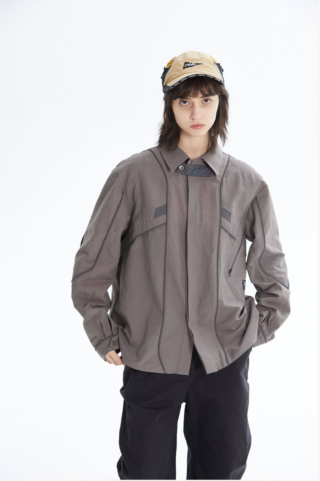 ERRORCODE ROBOT taupe tech work shirt — front modeled view with hands in pockets