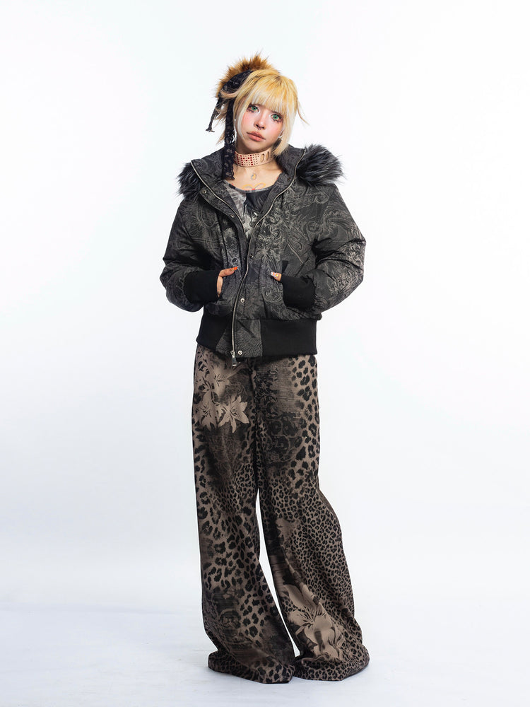4RE1GN GOTHIC down jacket in charcoal ornamental print — Full-body modeled view with jacket partly open and patterned flared trousers.