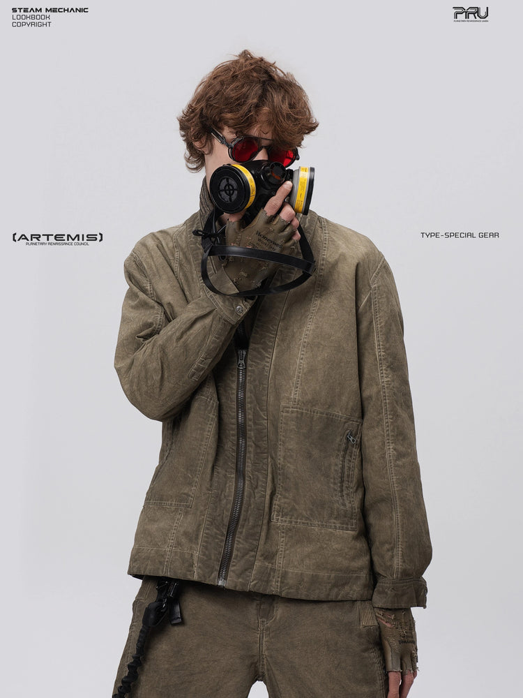 GAIA gravel brown open-collar technical robe — front modeled view with a respirator held to the face