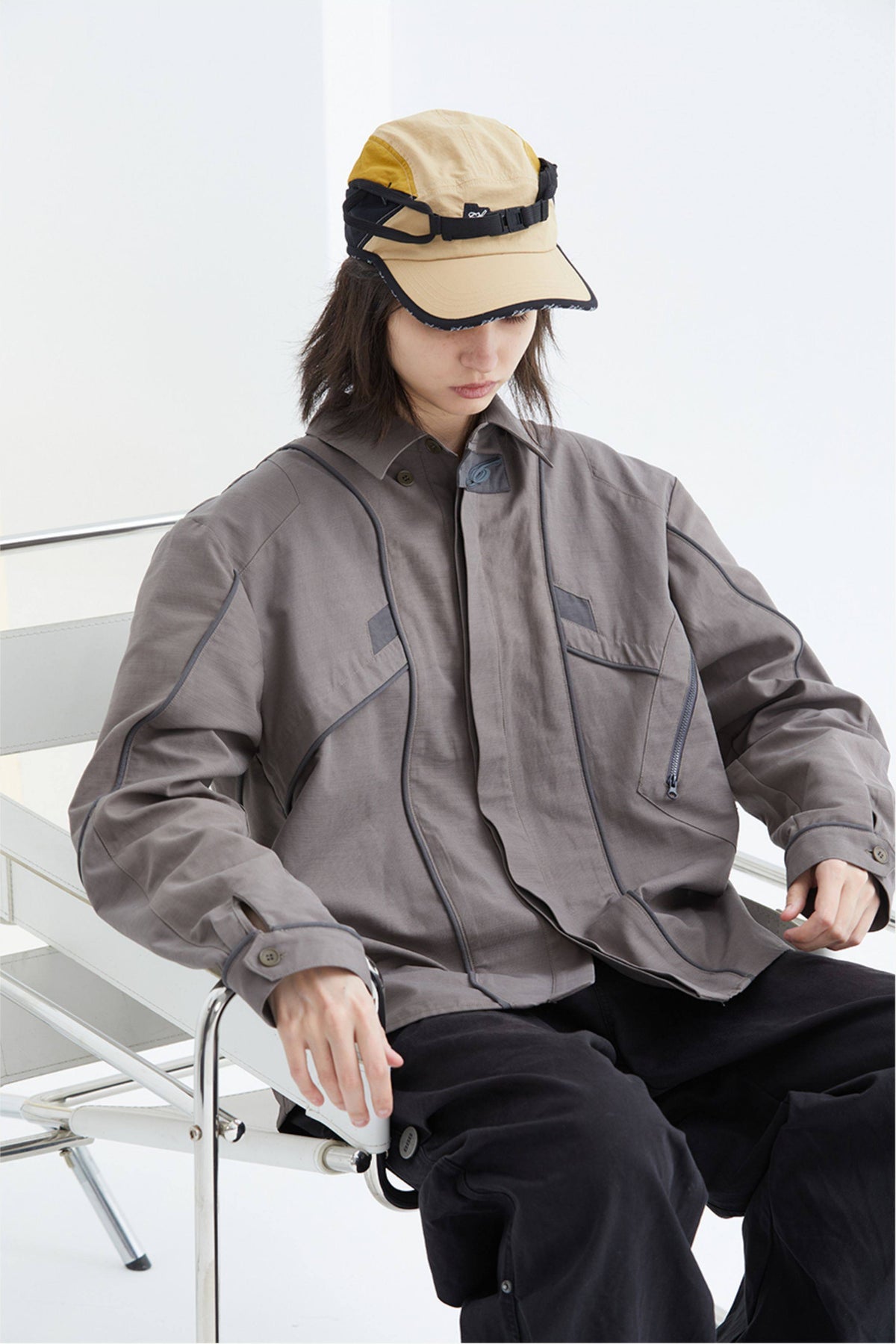 ERRORCODE ROBOT taupe tech work shirt — seated modeled view looking down