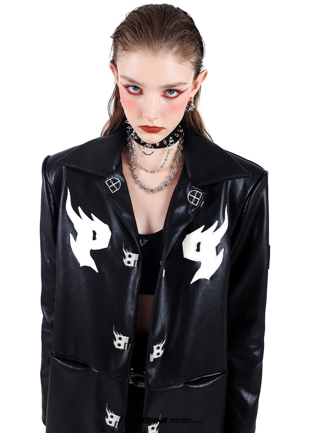 PINKSPINK SPIKE RING studded chain choker in black — close front modeled view with a black logo buckle jacket