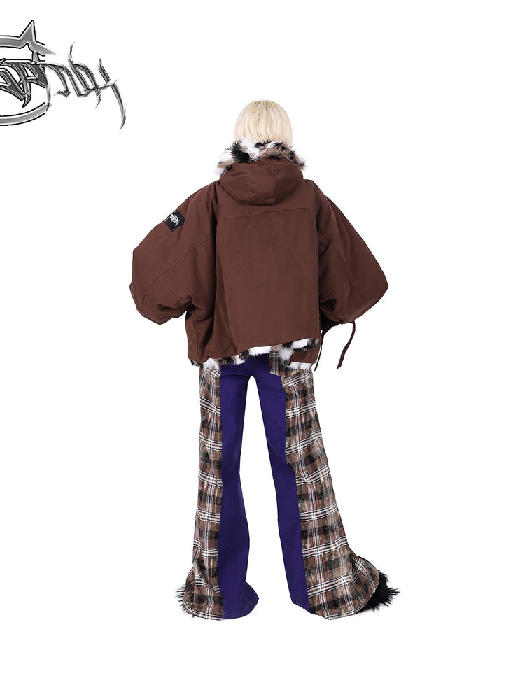 PINKSPINK DNA purple plaid split-panel wide-leg pants — back full-length modeled view styled with a padded jacket
