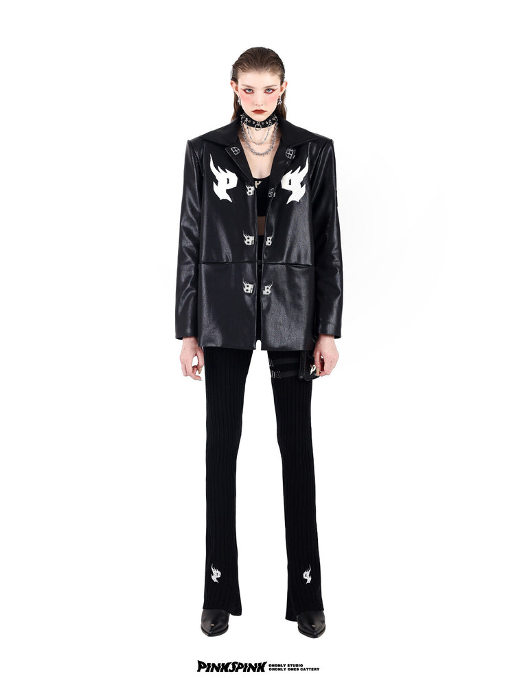 PINKSPINK SPIKE RING studded chain choker in black — full-length front modeled view with a black buckle jacket and flared trousers