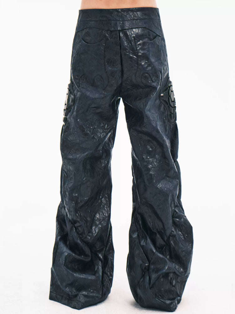 EMBRYO GUARD SHELL ruched PU leather flare pants — back modeled view