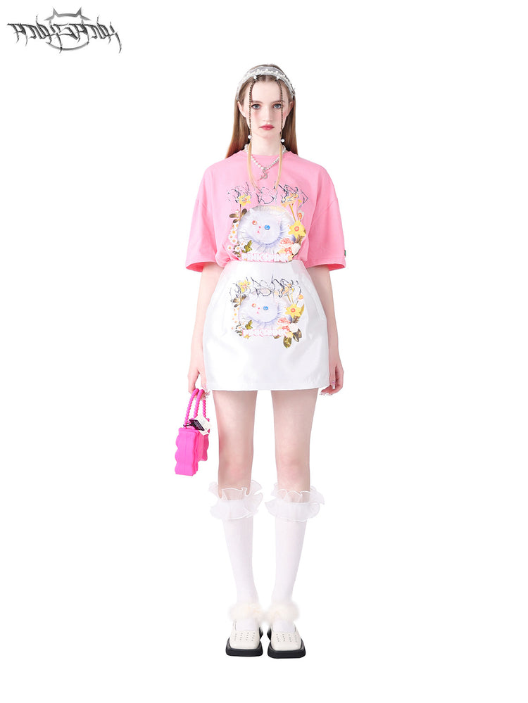 PINKSPINK GARFIELD oversized graphic tee — pink front view tucked into a matching white skirt