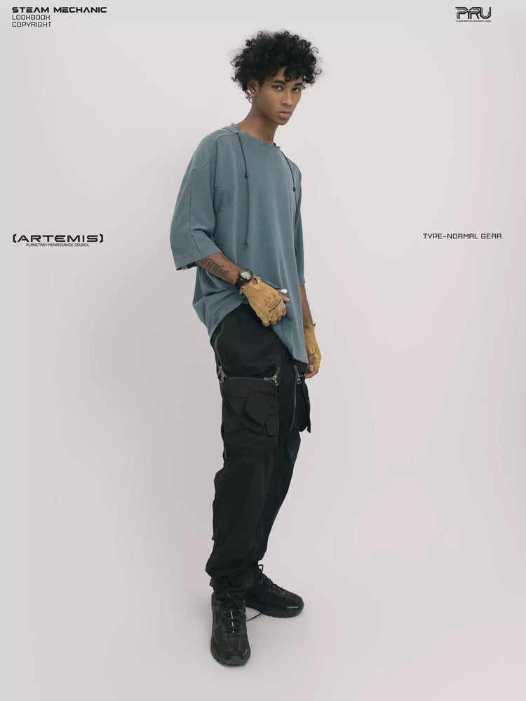 LIGHTSHADOW mycelium blue deconstructed technical tee — full-length angled front view holding the hem