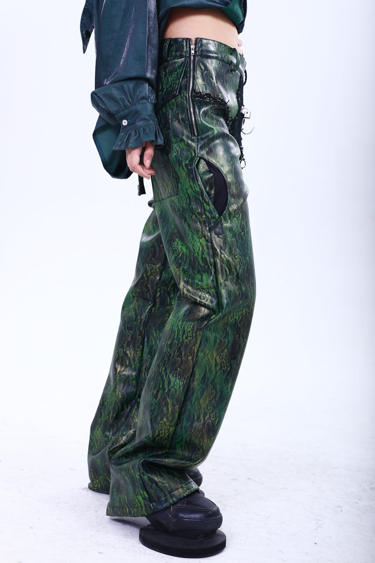 EMBRYO TRIANGLE ARMOR lace-inset leather pants — product-only rear view