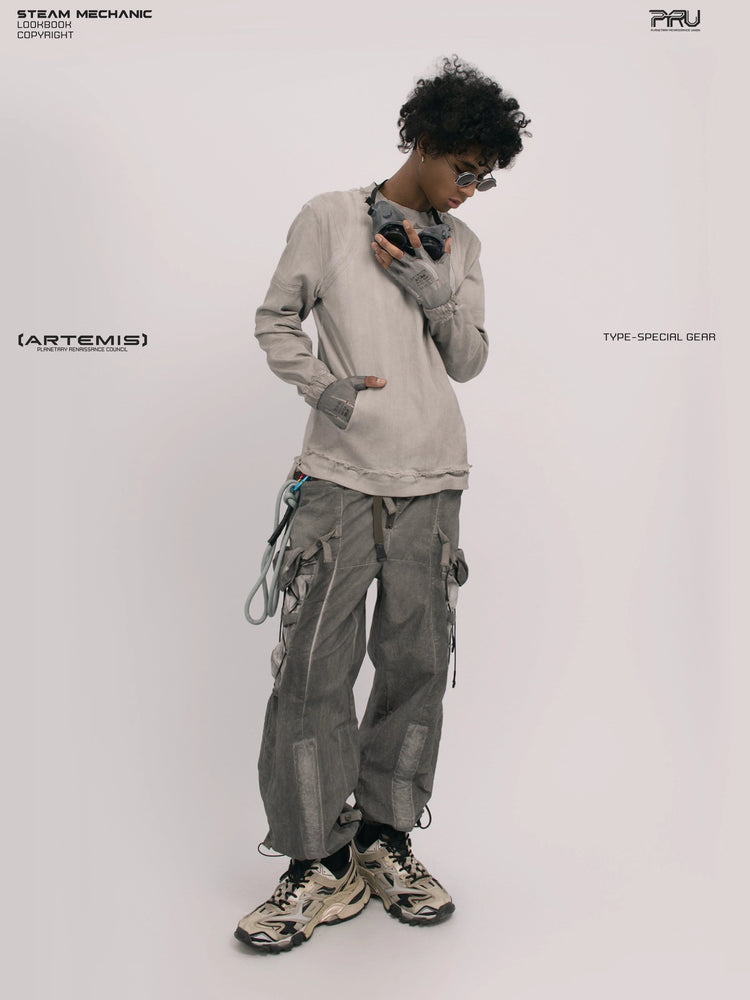 CHAOS ERA eris white raw-edge long-sleeve top — full-length front view holding the goggles