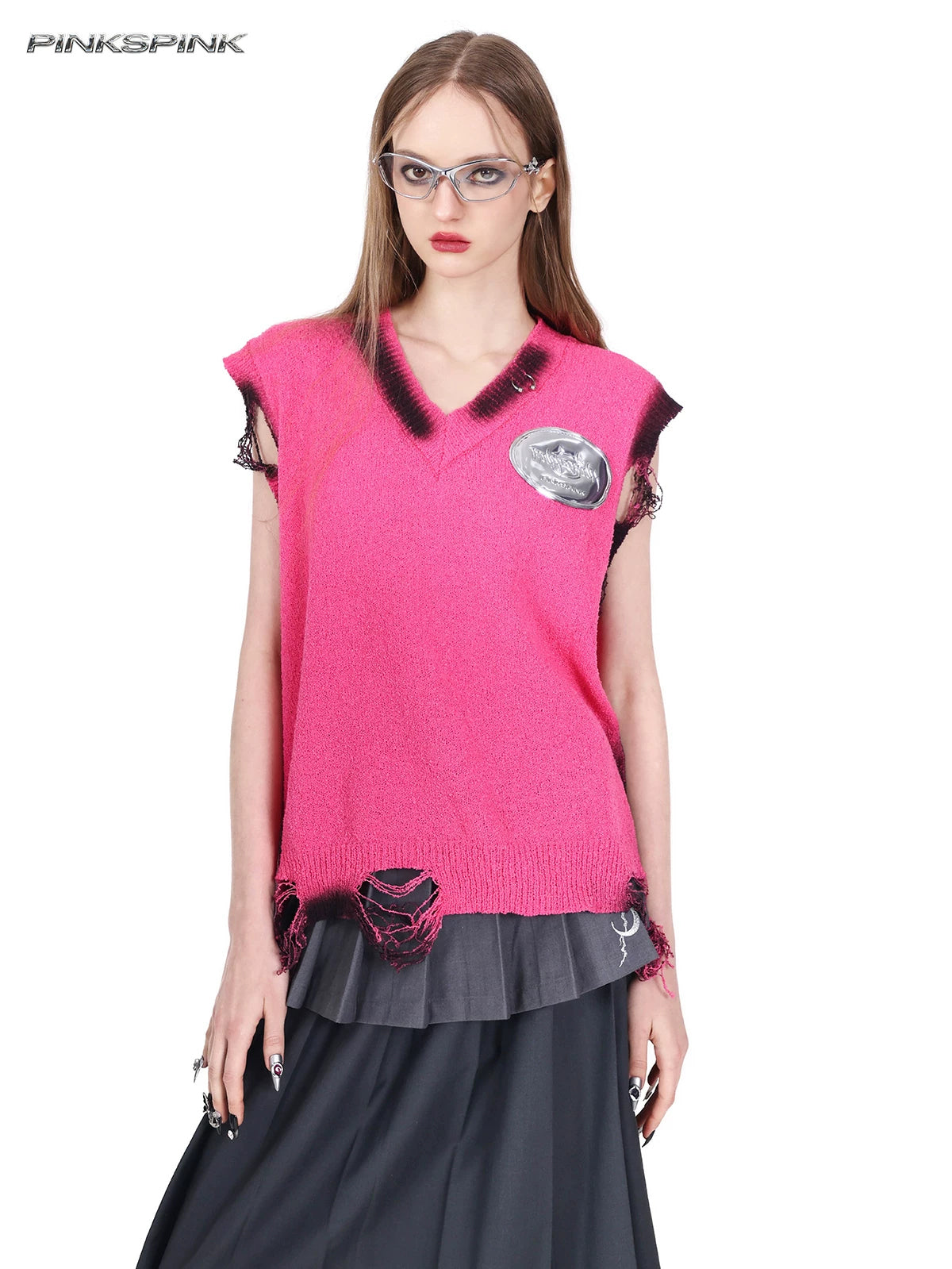 PINKSPINK REBEL distressed ring-detail knit vest in pink — close front modeled view showing the V-neck, metallic badge and distressed hem