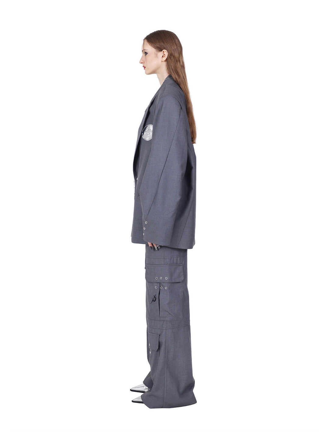 PINKSPINK REBEL pierced oversized tailored blazer in gray — side view showing the loose oversized fit and long sleeves