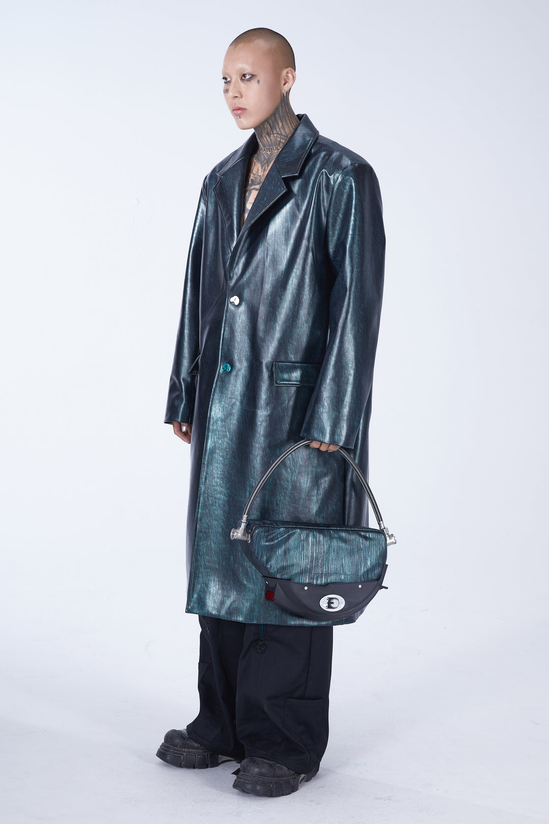 EMBRYO MATRIX buckle PU leather trench coat — construction and silhouette detail
