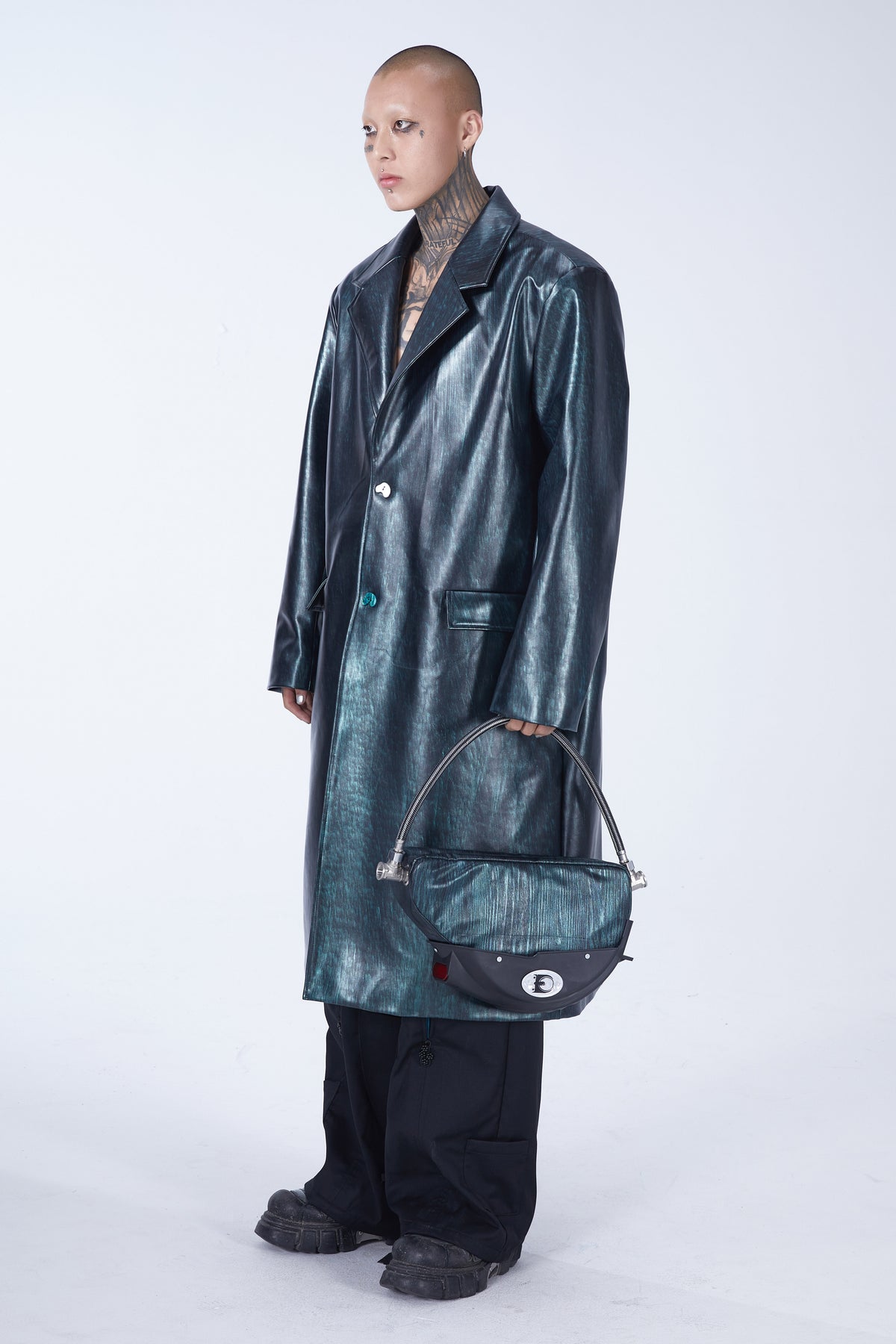 EMBRYO TIRELINE embossed underarm bag — material and hardware detail