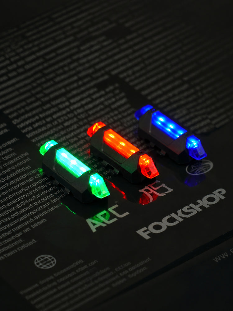 FOCKSHOP TRAIN L rechargeable costume light pair — red, blue and green illuminated lights in an angled group