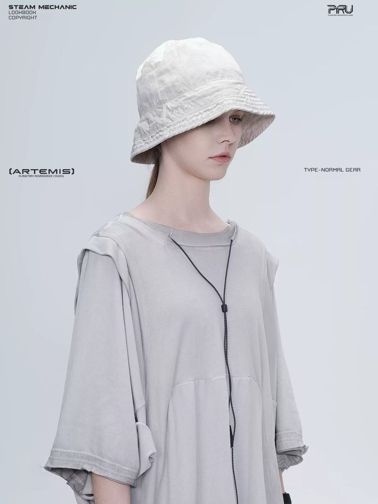 PIONEER eris white distressed nylon bucket hat — right-facing close-up showing the brim logo
