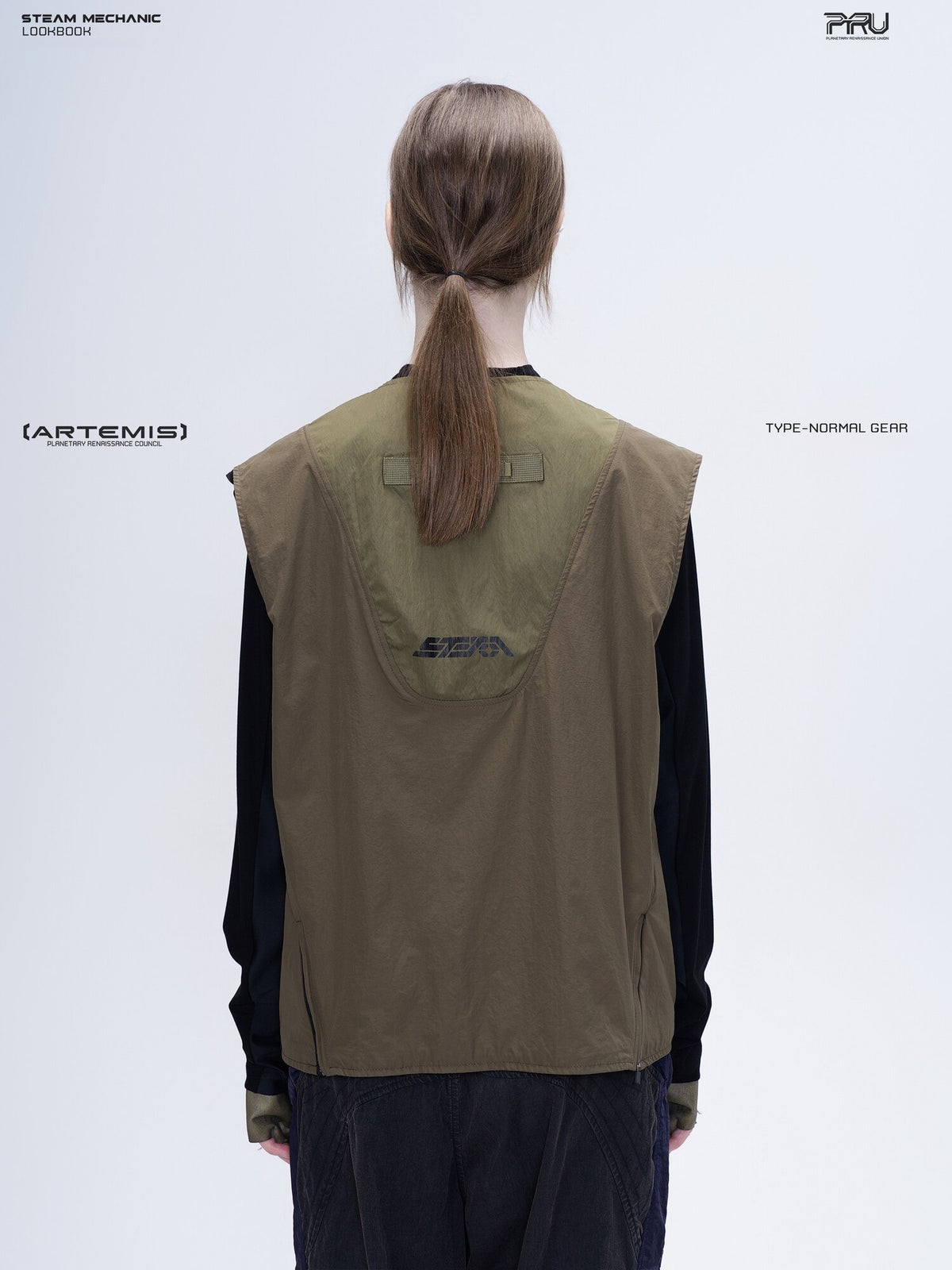 CLERIC utility nylon vest in vine gray green — back modeled view showing the curved logo panel