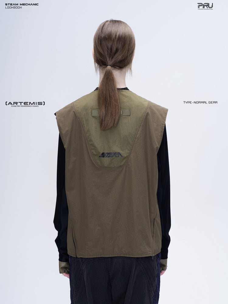 CLERIC utility nylon vest in vine gray green — back modeled view showing the curved logo panel