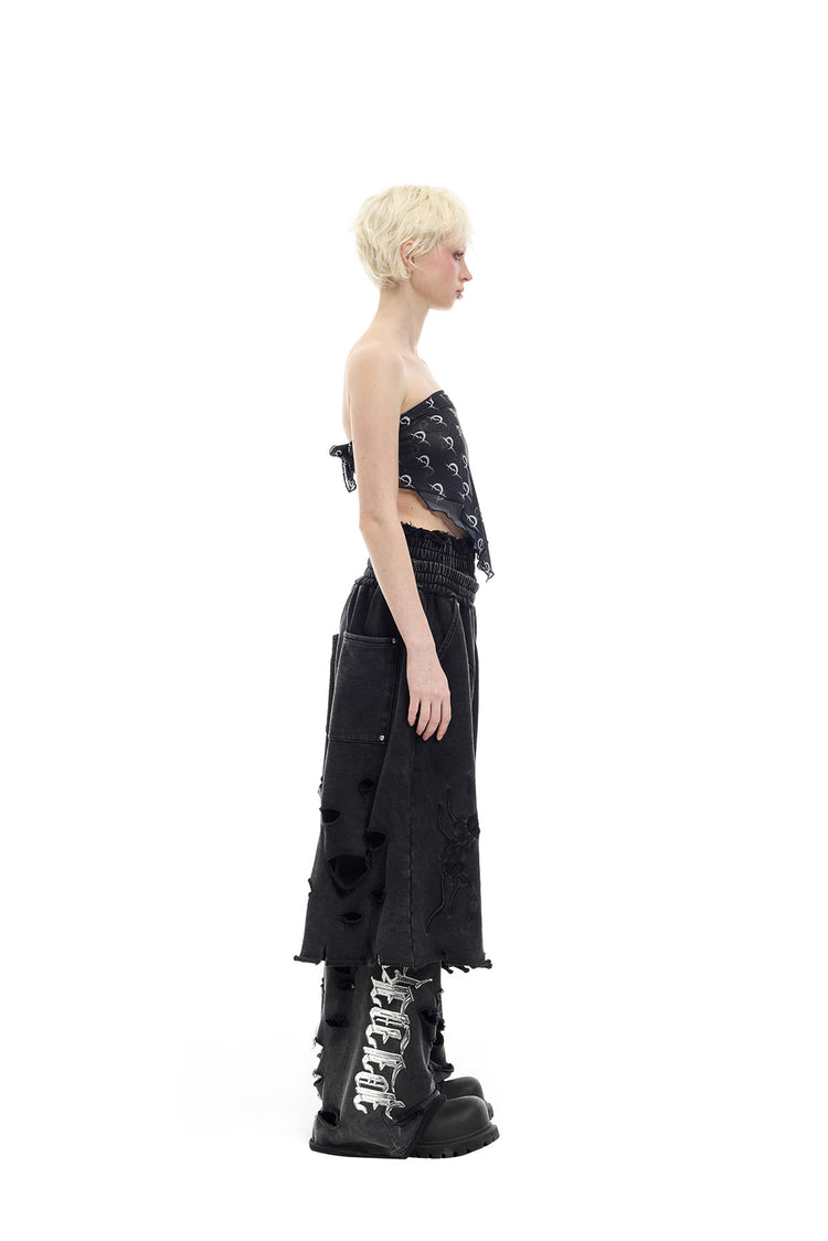 PINKSPINK ELECTRIC MOON distressed embroidered wide-leg shorts — black — profile view of the cropped wide-leg silhouette