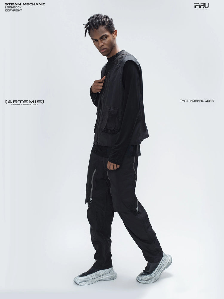ARTEMIS stardust black stretch technical base-layer top — side full-length styling view with a separate utility vest