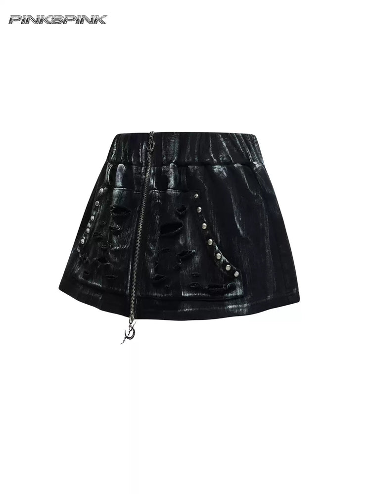 PINKSPINK ELECTRIC MOON coated zip-front mini skirt in black — front garment-only view showing distressed pockets, studs and crescent zipper pull