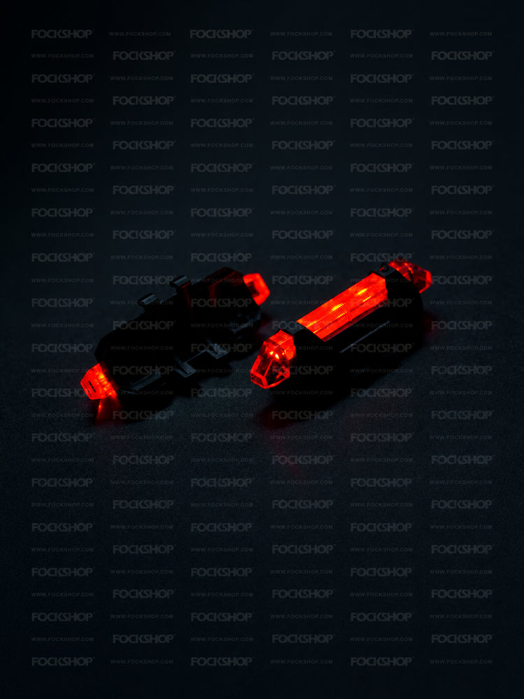 FOCKSHOP TRAIN L rechargeable costume light pair — red lights showing the illuminated front and mounting back