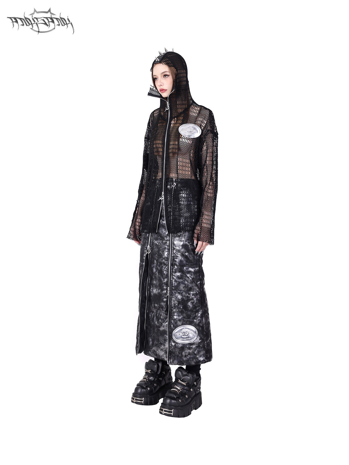 PINKSPINK ELECTRIC MOON spiked open-mesh zip hoodie in black — angled full-length modeled view styled with a zip-panel skirt
