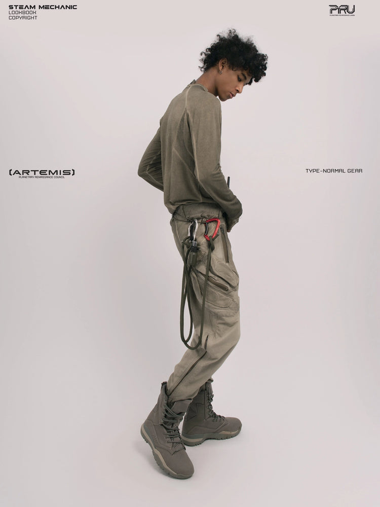 TWIN STAR lunar soil teal stretch riding base-layer top — full-length rear three-quarter view looking down