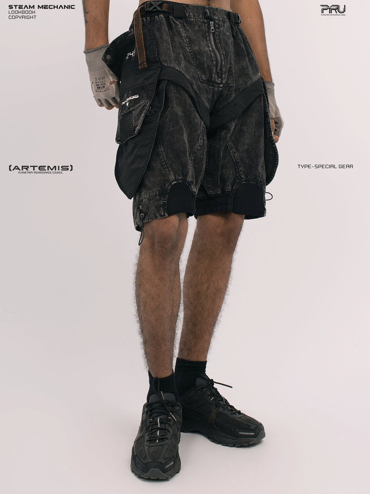 ARTEMIS blackbird black detachable technical shorts — opposite three-quarter front view with both hands down